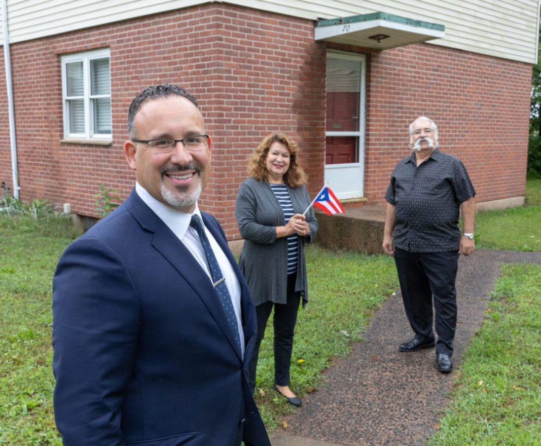 Miguel Cardona with his parents in Meriden